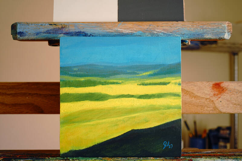 A painting of a valley in bright yellow bloom.
